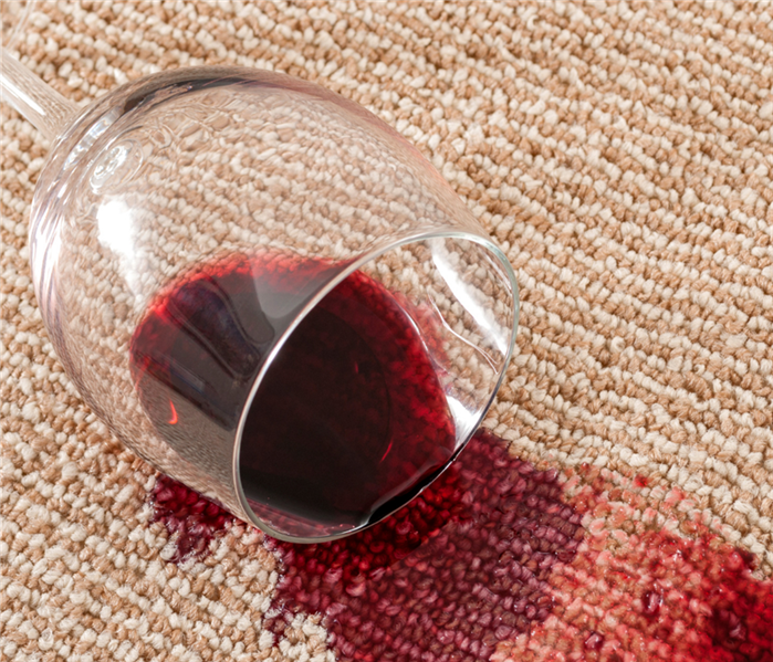 fallen wine glass on carpet