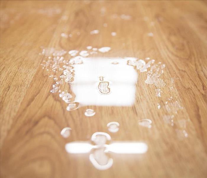 image of standing water on wooden floor
